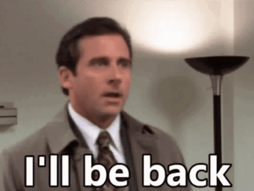 A Man In A Suit And Tie Is Standing Next To A Lamp And Says `` I 'Ll Be Back '' . GIF