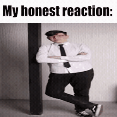 A Man In A Suit And Tie Is Standing Next To A Pole With His Arms Crossed . GIF