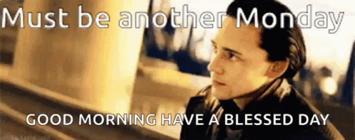 A Man In A Suit And Tie Is Standing Next To A Sign That Says Must Be Another Monday GIF