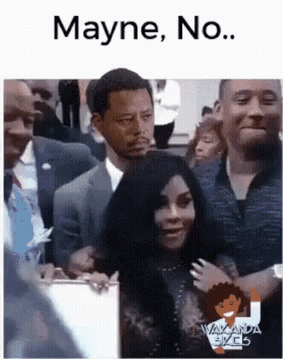 A Man In A Suit And Tie Is Standing Next To A Woman In A Crowd And Says Mayne No . GIF
