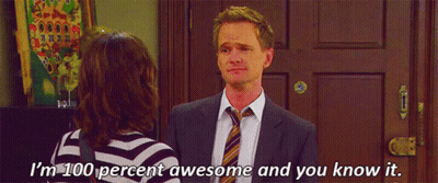 A Man In A Suit And Tie Is Standing Next To A Woman In A Striped Shirt And Talking To Her . GIF