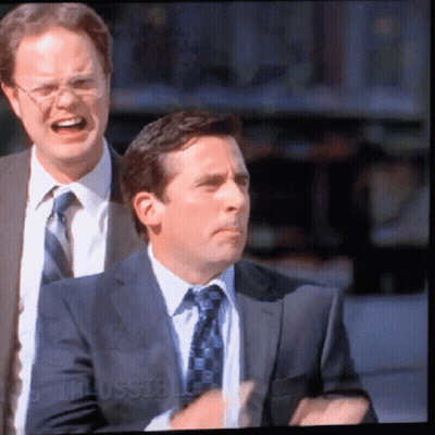 A Man In A Suit And Tie Is Standing Next To Another Man In A Suit And Tie With The Word Russell On The Bottom GIF