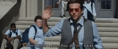 A Man In A Suit And Tie Is Standing On A Set Of Stairs Talking To A Boy . GIF