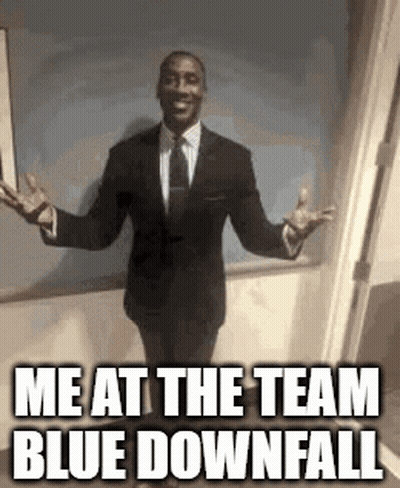 A Man In A Suit And Tie Is Standing With His Arms Outstretched And Says `` Me At The Team Blue Downfall '' GIF