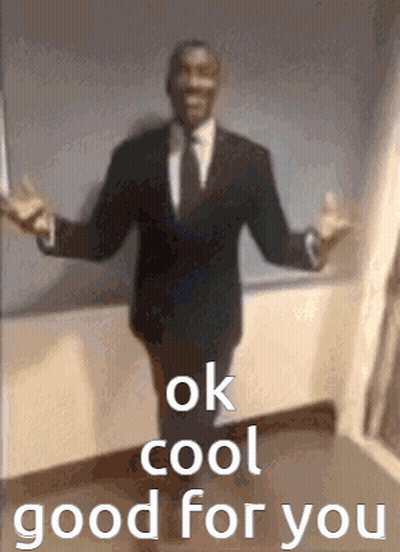 A Man In A Suit And Tie Is Standing With His Arms Outstretched And The Words `` Ok Cool Good For You '' . GIF
