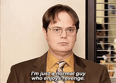 A Man In A Suit And Tie Is Talking About Being A Normal Guy Who Enjoys Revenge . GIF