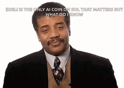 A Man In A Suit And Tie Is Talking About Deli GIF