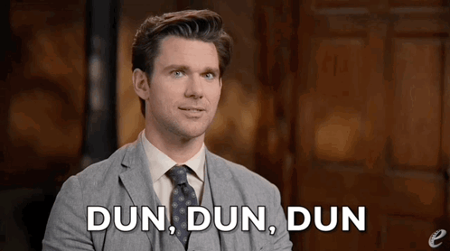 A Man In A Suit And Tie Is Talking About Dun Dun Dun . GIF