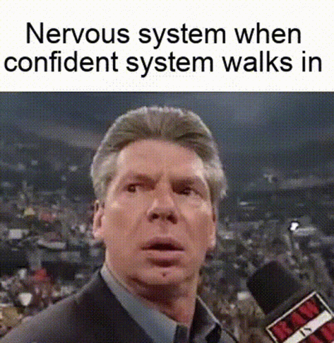 A Man In A Suit And Tie Is Talking Into A Microphone While A Nervous System When Confident System Walks In . GIF