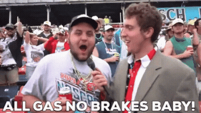 A Man In A Suit And Tie Is Talking Into A Microphone With The Words All Gas No Brakes Baby On The Bottom GIF