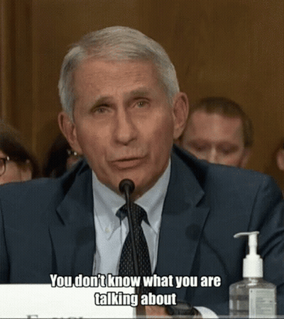 A Man In A Suit And Tie Is Talking Into A Microphone With The Words " You Don 'T Know What You Are Talking About " GIF