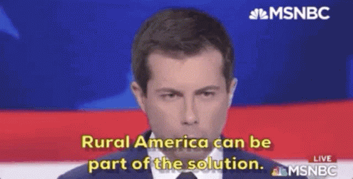 A Man In A Suit And Tie Is Talking On A Television Screen . GIF