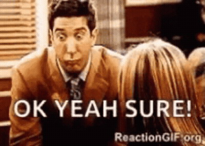 A Man In A Suit And Tie Is Talking To A Woman And Says Ok Yeah Sure GIF