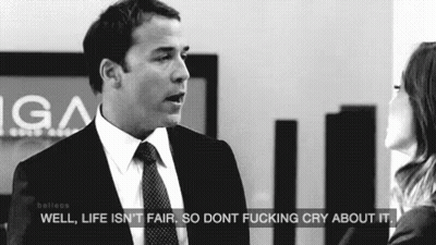 A Man In A Suit And Tie Is Talking To A Woman In A Black And White Photo . GIF