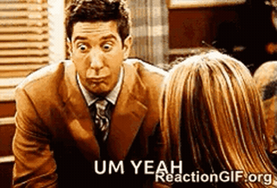 A Man In A Suit And Tie Is Talking To A Woman In A Restaurant . GIF