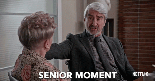 A Man In A Suit And Tie Is Talking To A Woman In A Wheelchair And The Caption Says Senior Moment GIF