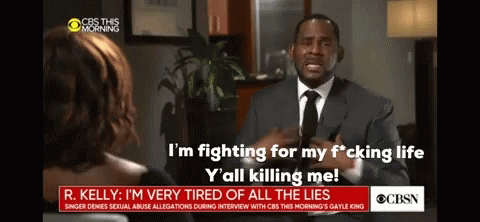 A Man In A Suit And Tie Is Talking To A Woman On Cbs GIF