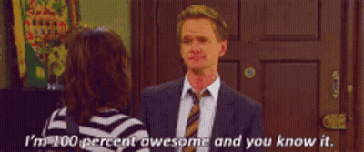 A Man In A Suit And Tie Is Talking To A Woman Who Is Wearing A Striped Shirt GIF