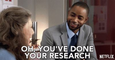 A Man In A Suit And Tie Is Talking To A Woman With The Words Oh You 'Ve Done Your Research On The Bottom GIF