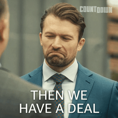 A Man In A Suit And Tie Is Talking To Another Man And Says Then We Have A Deal GIF