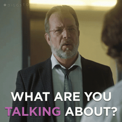 A Man In A Suit And Tie Is Talking To Another Man And The Caption Says What Are You Talking About GIF