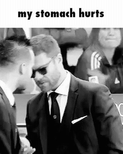 A Man In A Suit And Tie Is Talking To Another Man In A Black And White Photo . GIF