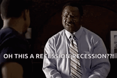 A Man In A Suit And Tie Is Talking To Another Man In A Room . GIF