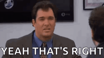 A Man In A Suit And Tie Is Talking To Another Man In A Room And Saying `` Yeah That 'S Right '' . GIF