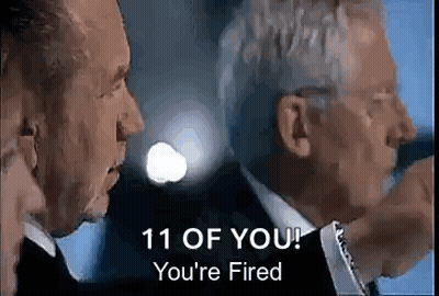 A Man In A Suit And Tie Is Talking To Another Man In A Suit . GIF