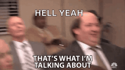 A Man In A Suit And Tie Is Talking To Another Man In A Suit . GIF