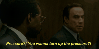 A Man In A Suit And Tie Is Talking To Another Man With The Words " Pressure You Wanna Turn Up The Pressure " Behind Him GIF