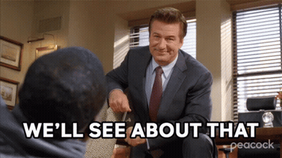 A Man In A Suit And Tie Is Talking To Another Man With The Words " We 'Ll See About That " Below Him GIF