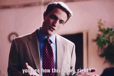 A Man In A Suit And Tie Is Talking To Someone And Says " You See How This Looks Right " GIF