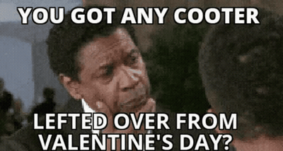 A Man In A Suit And Tie Is Thinking About Valentine 'S Day And Has Left Over From Valentine 'S Day ? GIF