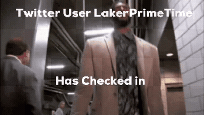 A Man In A Suit And Tie Is Walking Down A Hallway Next To A Man In A Suit And Tie . GIF