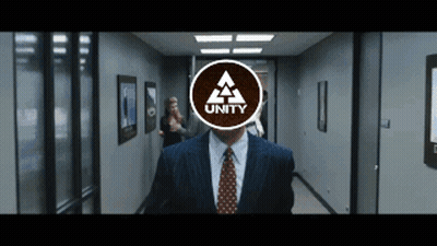 a man in a suit and tie is walking down a hallway with the word unity on his face