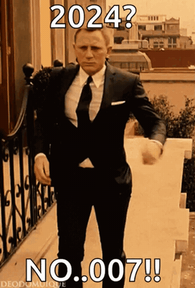A Man In A Suit And Tie Is Walking Down A Set Of Stairs With A Caption That Says 2024 No 007 GIF