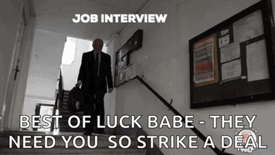 A Man In A Suit And Tie Is Walking Down A Set Of Stairs With The Caption Job Interview Best Of Luck Babe GIF