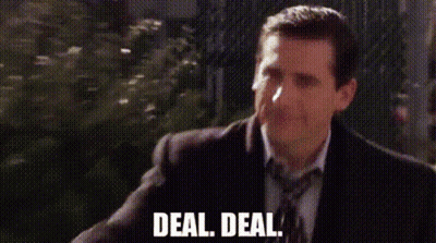 A Man In A Suit And Tie Is Walking Down A Street And Says `` Deal , Deal '' . GIF