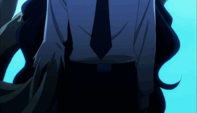 A Man In A Suit And Tie Is Walking In The Dark GIF