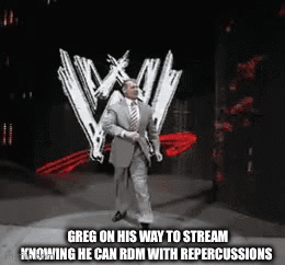 A Man In A Suit And Tie Is Walking On A Stage In Front Of A W Logo . GIF