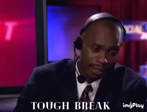 A Man In A Suit And Tie Is Wearing A Headset And Saying Tough Break GIF
