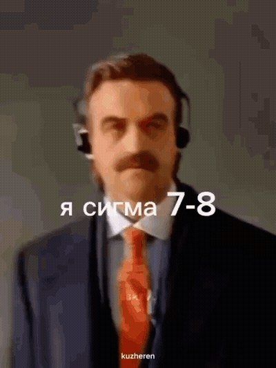 A Man In A Suit And Tie Is Wearing A Headset And The Number 7-8 Is Above Him GIF