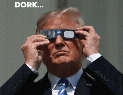 A Man In A Suit And Tie Is Wearing A Pair Of Nasa Glasses GIF