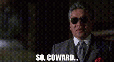 A Man In A Suit And Tie Is Wearing Sunglasses And Saying `` So , Coward . '' GIF
