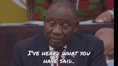 A Man In A Suit And Tie Is Wearing Sunglasses With The Word Fokol Written On The Bottom GIF