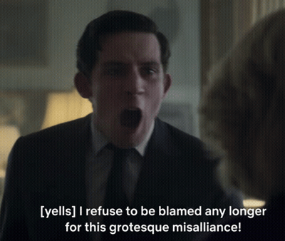 A Man In A Suit And Tie Is Yelling At A Woman GIF
