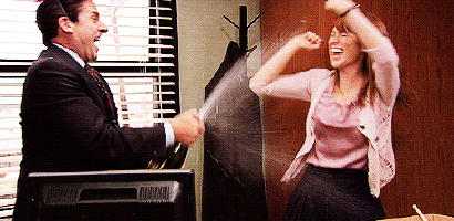 A Man In A Suit And Tie Is Yelling At A Woman Who Is Holding An Umbrella GIF