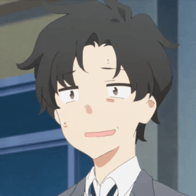 A Man In A Suit And Tie Making A Face GIF