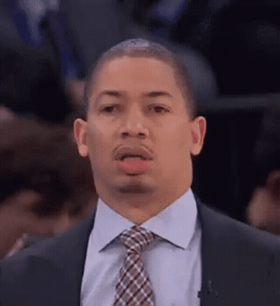 A Man In A Suit And Tie Making A Funny Face . GIF
